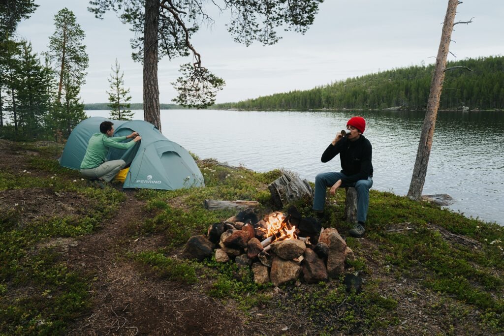 two guys camping river side