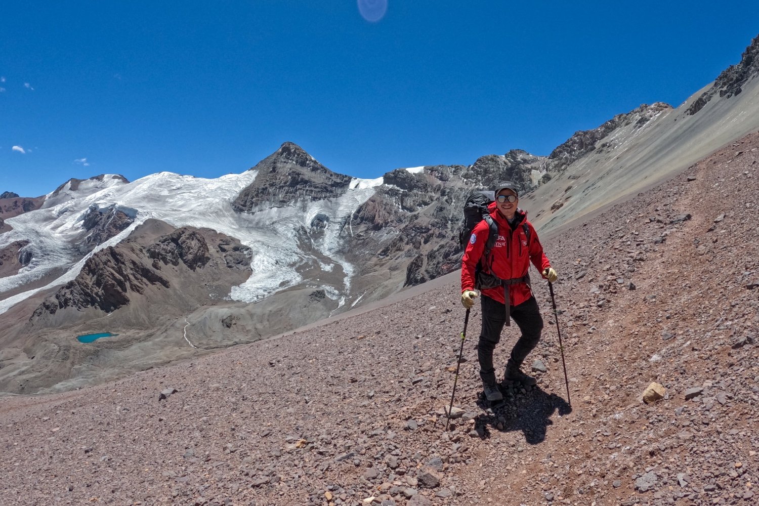 even sverdrup on a hillside hiking up aconcagua