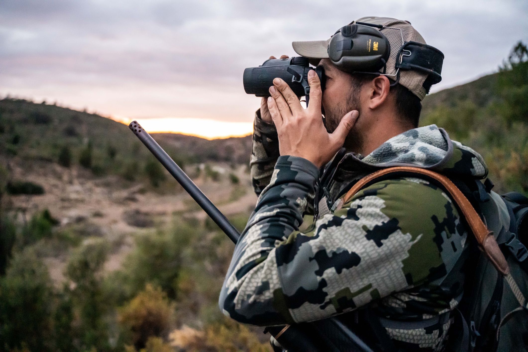 hunter looking for animals in the distance