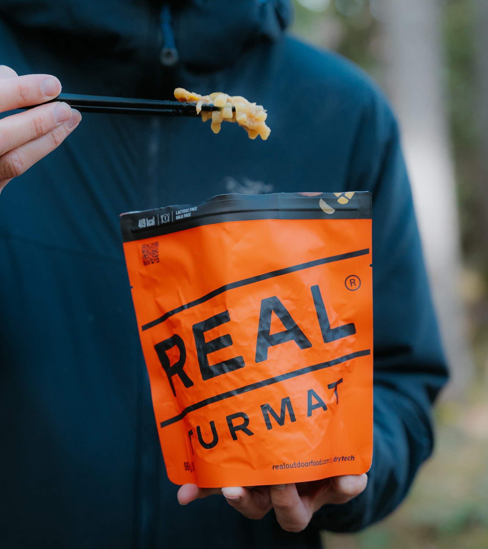 eating real turmat ramen noodles with chop sticks