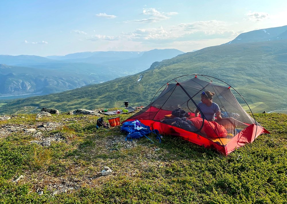 woman inside a tent in the summer